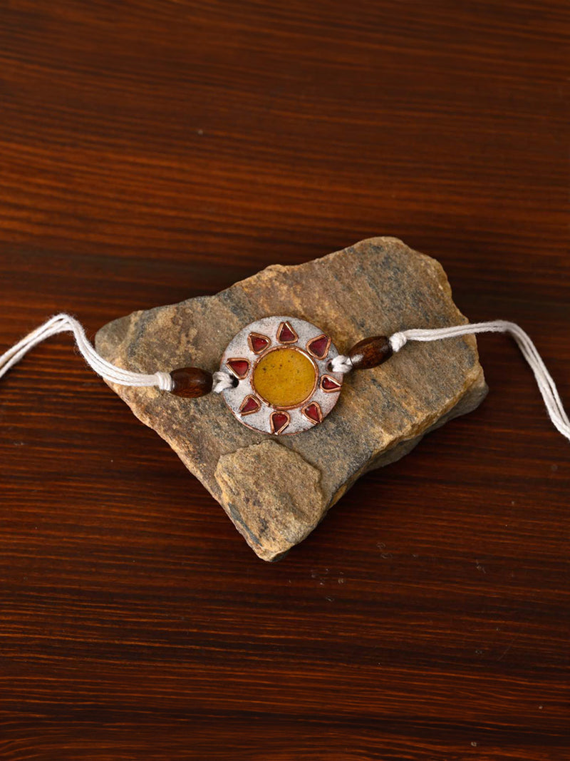 Shop Handcrafted "Sooraj" Copper Enamel Rakhi by EkiBeki