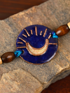 Handcrafted Chanda Copper Enamel Rakhi by EkiBeki for sale