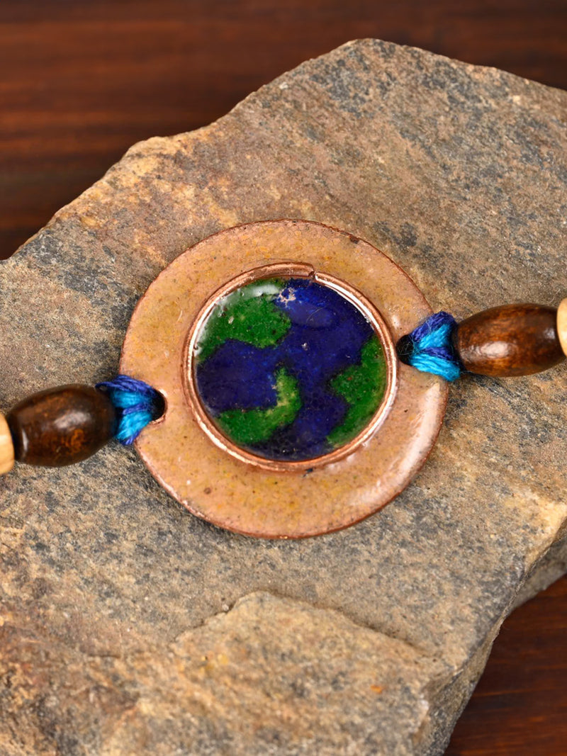 Buy Handcrafted "Earthy" Copper Enamel Rakhi by EkiBeki