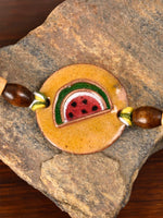 Shop Handcrafted "Tarbooz" Copper Enamel Rakhi by EkiBeki