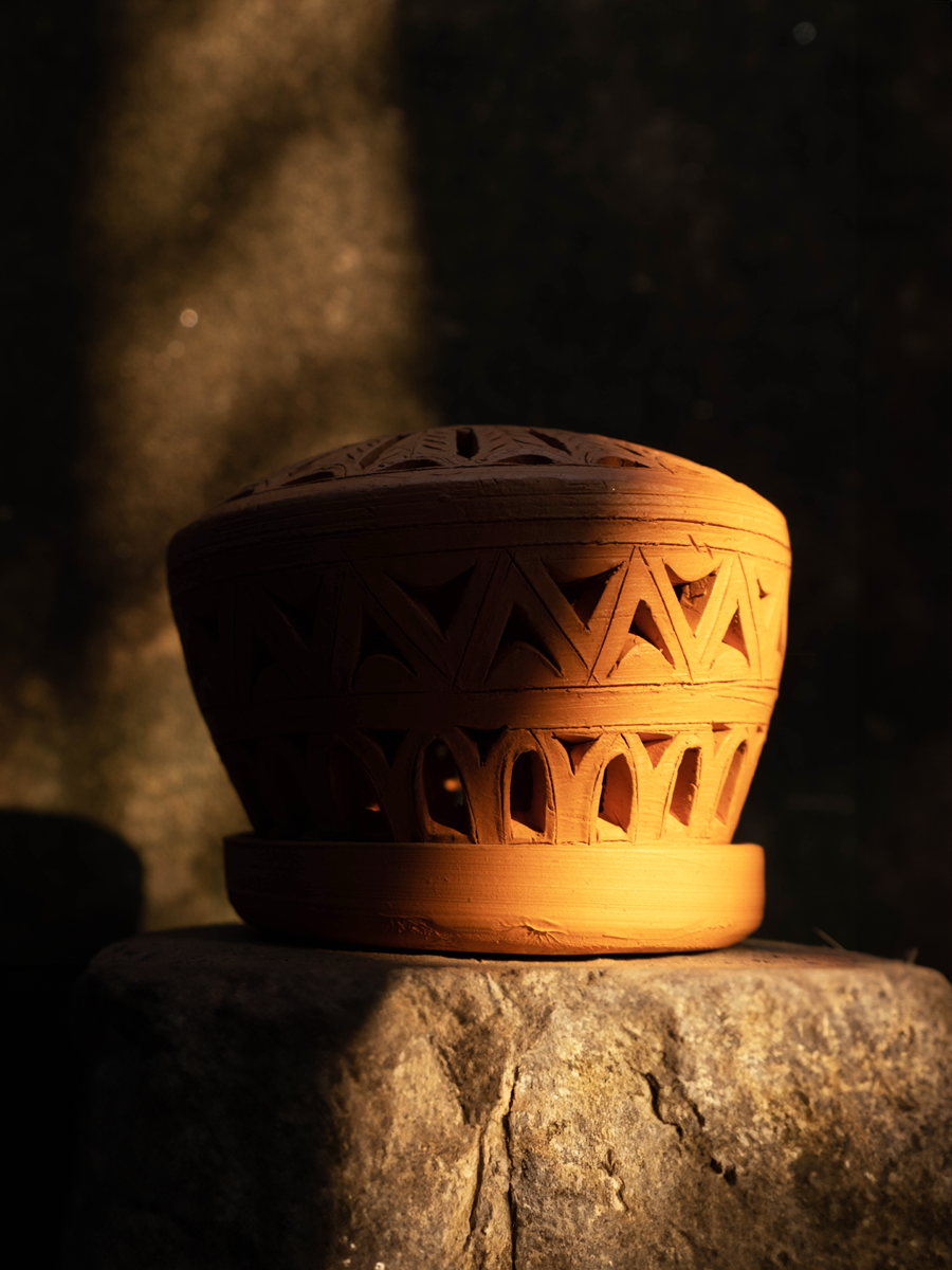 shopAn Illuminating Tea Light: Terracotta Art by Dolon Kundu