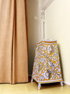 Enchanted Oasis: Regal beauty amidst a lush tapestry Tholu lamps by Kanday Anjanappa