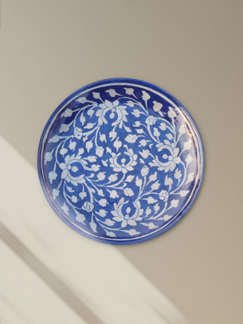 Shop Floral pattern on a plate In blue pottery