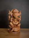 Shop Ganesha: Divine Guardian in Kadam Wood Carving by Om Prakash