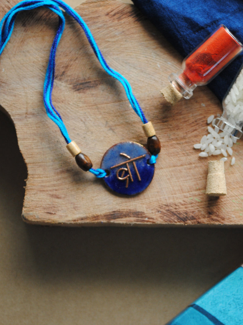 Shop Handcrafted "Bro" Copper Enamel Rakhi by EkiBeki