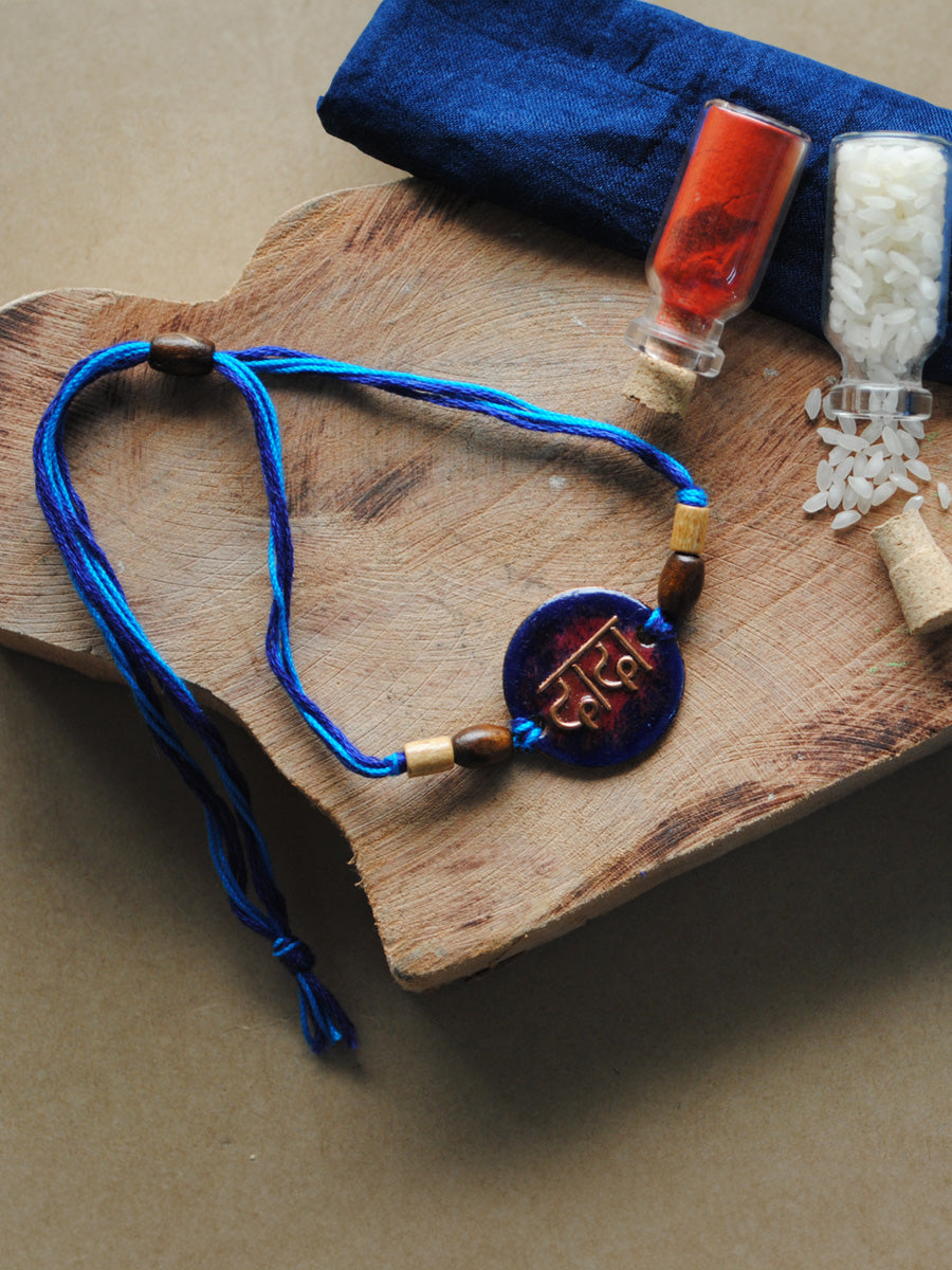 Shop Handcrafted "Dada" Copper Enamel Rakhi by EkiBeki