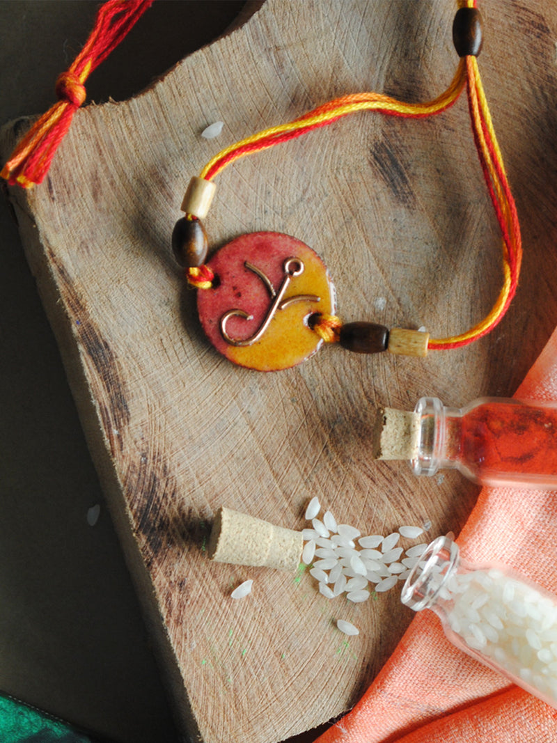 Shop Yellow - Orange Round Ganesha Rakhi