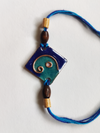 Light-Dark Blue Square Ganesha Rakhi for sale