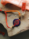 buy Handcrafted Swastika Copper Enamel Rakhi by EkiBeki