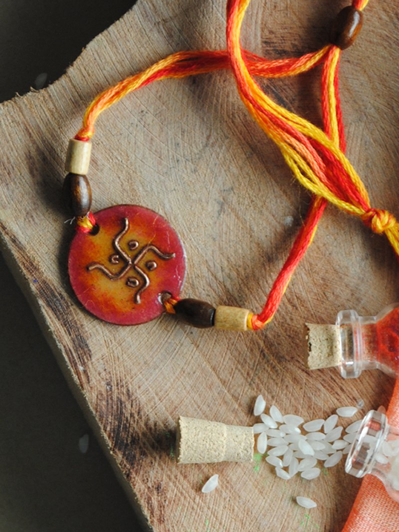 Handcrafted Swastika Copper Enamel Rakhi by EkiBeki shop