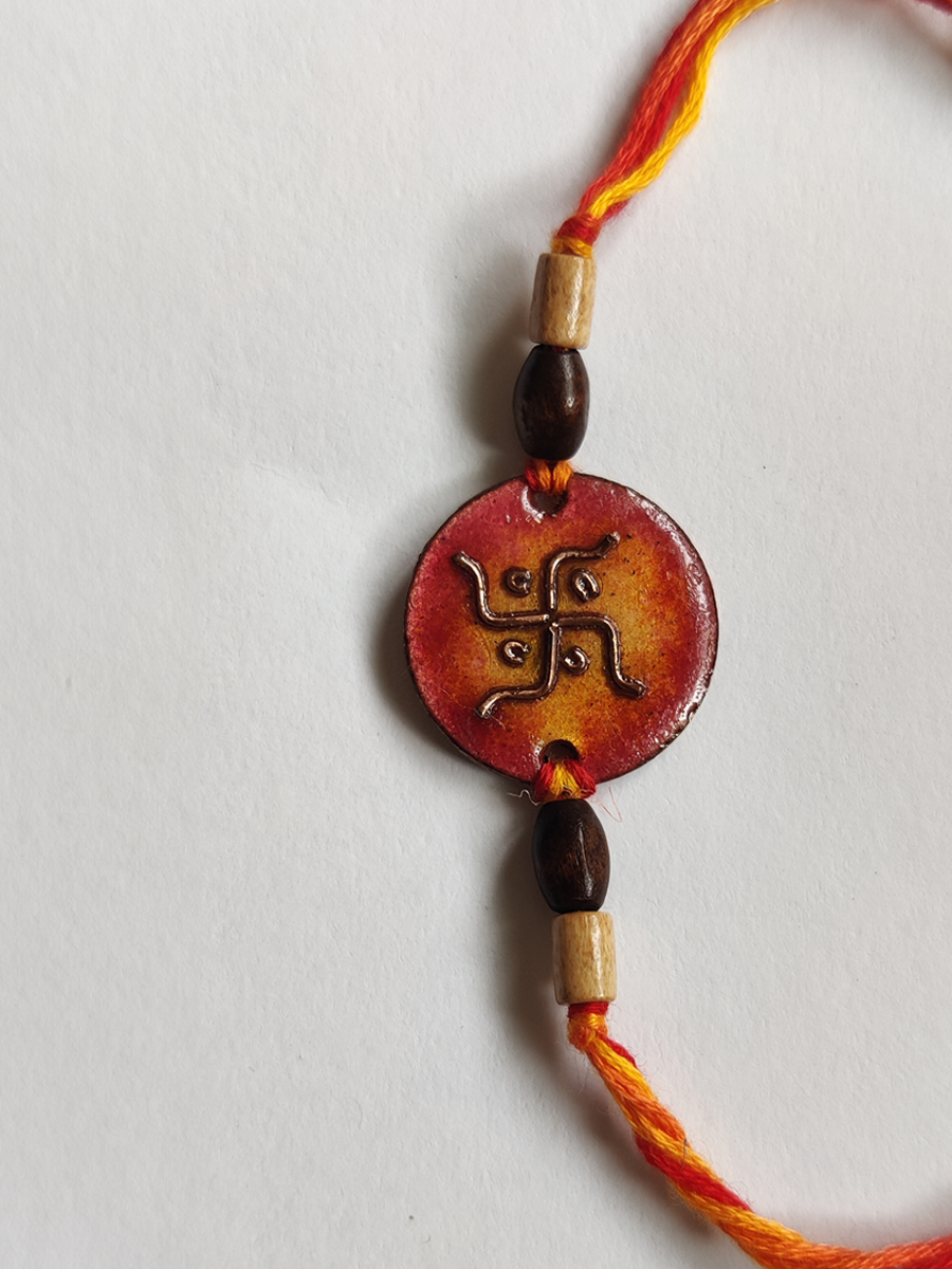 Handcrafted Swastika Copper Enamel Rakhi by EkiBeki