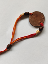 Handcrafted Swastika Copper Enamel Rakhi by EkiBeki