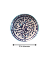 Two birds stylized design on a plate In Blue Pottery